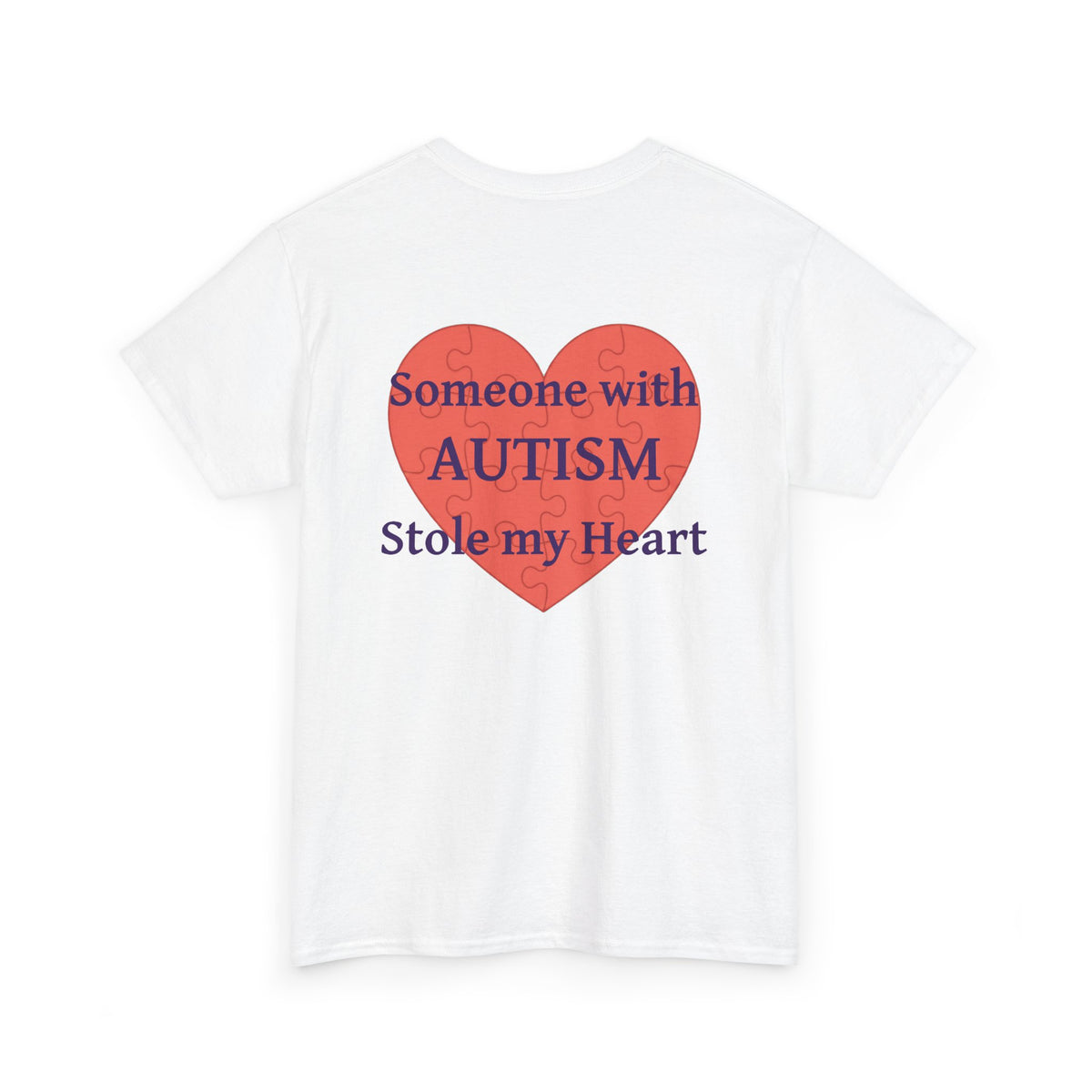 White t-shirt, back printed printed with a large salmon-red heart made of jigsaw puzzle pieces, lettered across it "Someone with AUTISM Stole my Heart", shown from another angle.