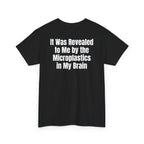 Black t-shirt, back printed with "It was revealed to me by the microplastics in my brain", shown from another angle.