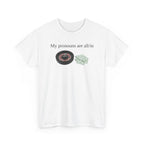 White t-shirt printed with "My pronouns are all/in" in serif type above a roulette wheel and a fanned pile of banknotes, shown flat from another angle.