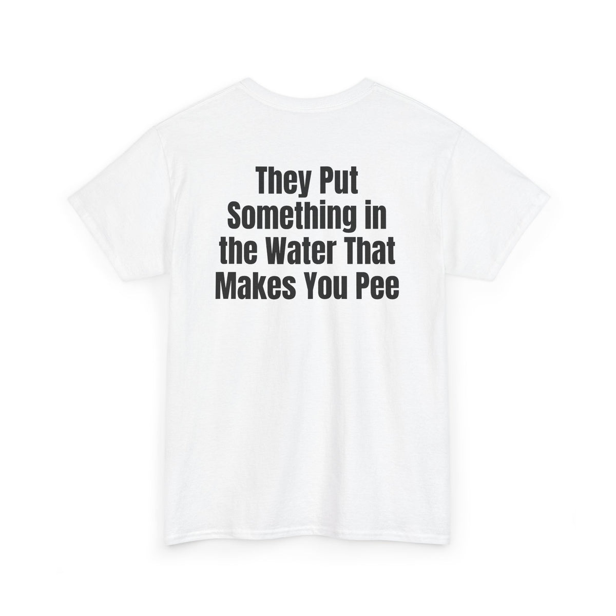 White t-shirt, back printed with "They put something in the water that makes you pee", shown from another angle.