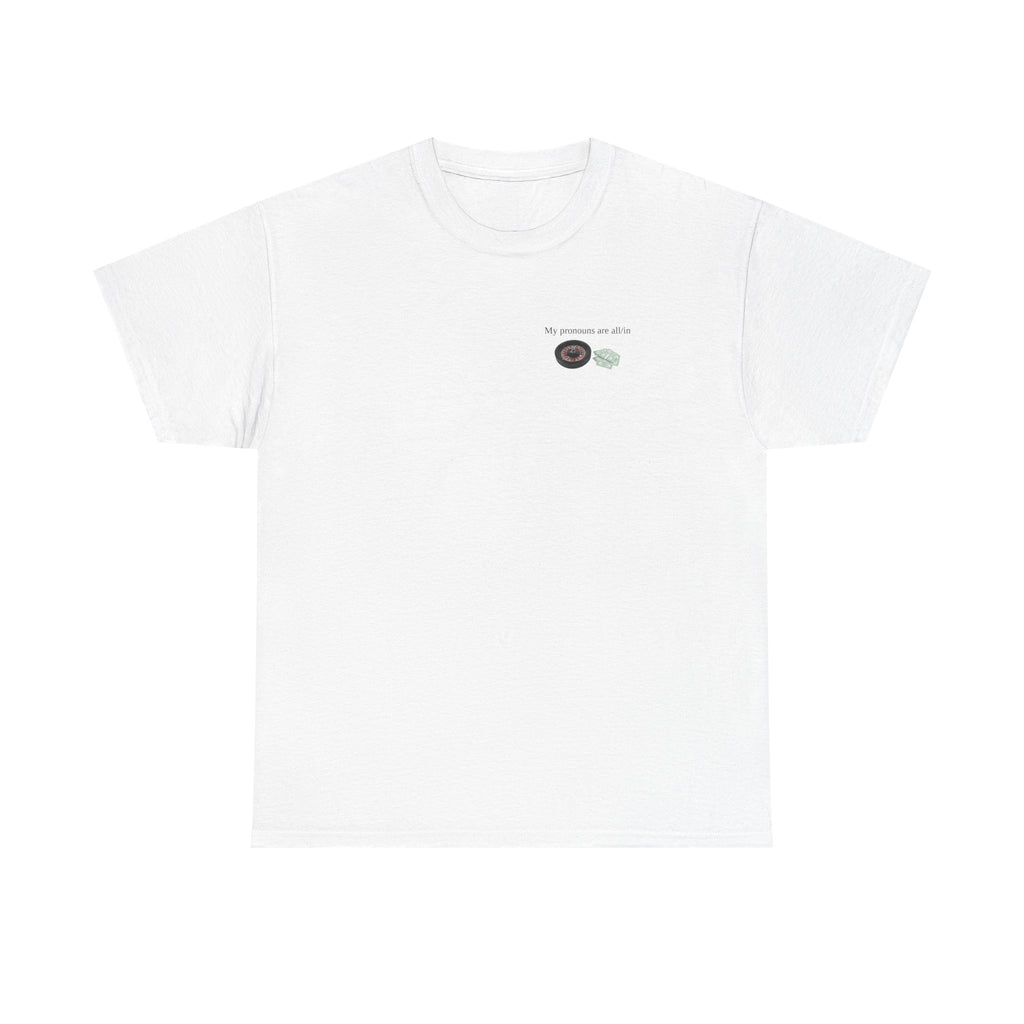 White t-shirt printed with "My pronouns are all/in" in serif type above a roulette wheel and a fanned pile of banknotes.