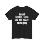 Black t-shirt, back printed with "im all healed. send me the exact same guy", shown from another angle.
