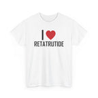 White t-shirt printed with "I", a large red heart, then the word RETATRUTIDE, shown flat from another angle.