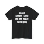 Black t-shirt, back printed with "im all healed. send me the exact same guy", shown from another angle.