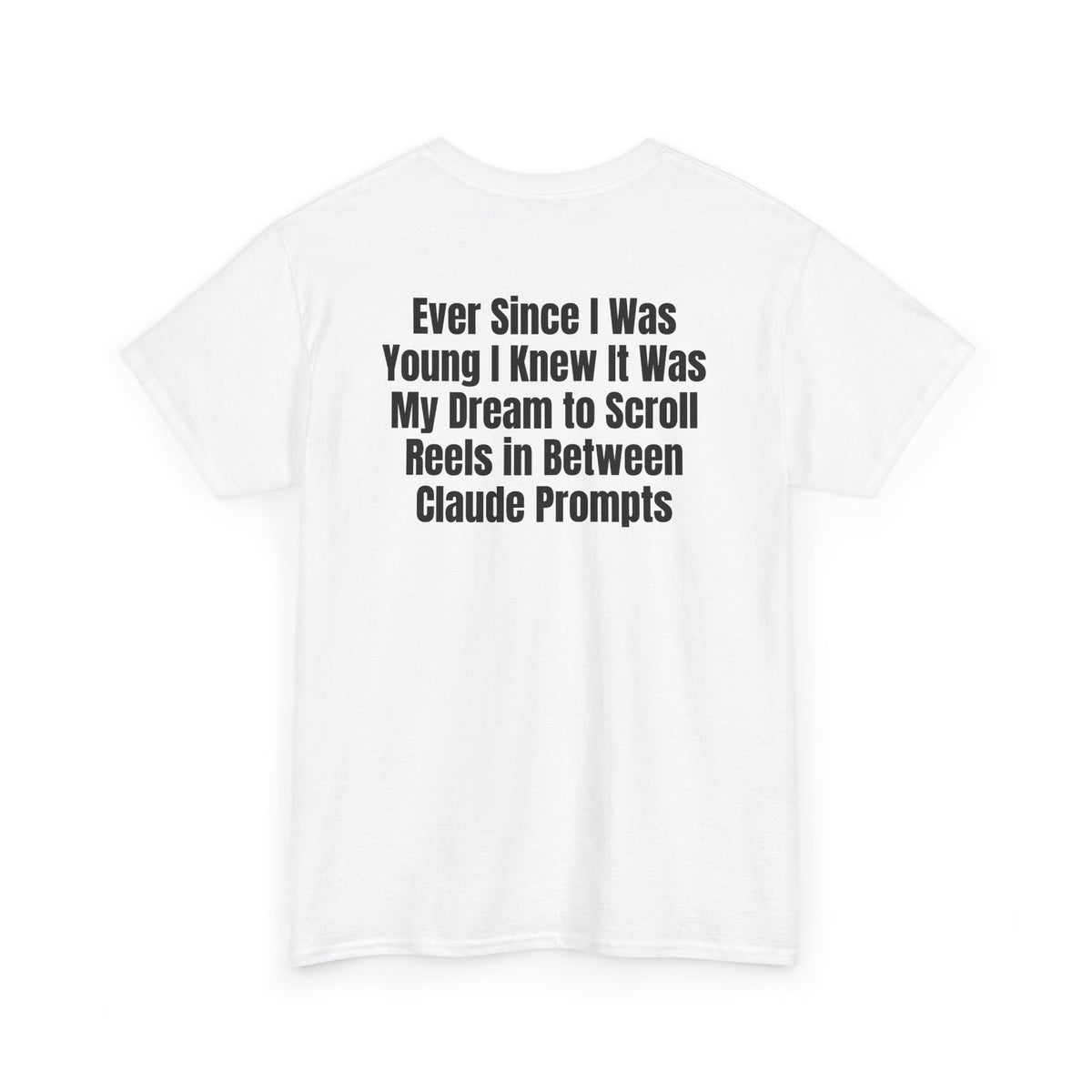 White t-shirt, back printed with "Ever since i was young i knew it was my dream to scroll reels in between Claude prompts", shown from another angle.
