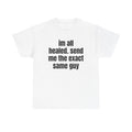 White t-shirt printed with "im all healed. send me the exact same guy".