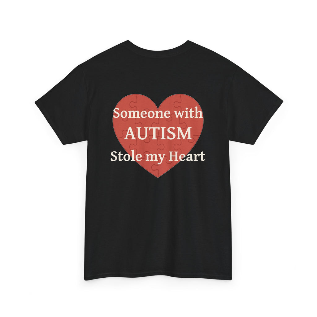 Black t-shirt, back printed printed with a large salmon-red heart made of jigsaw puzzle pieces, lettered across it "Someone with AUTISM Stole my Heart", shown from another angle.