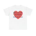 White t-shirt printed with a large salmon-red heart made of jigsaw puzzle pieces, lettered across it "Someone with AUTISM Stole my Heart".