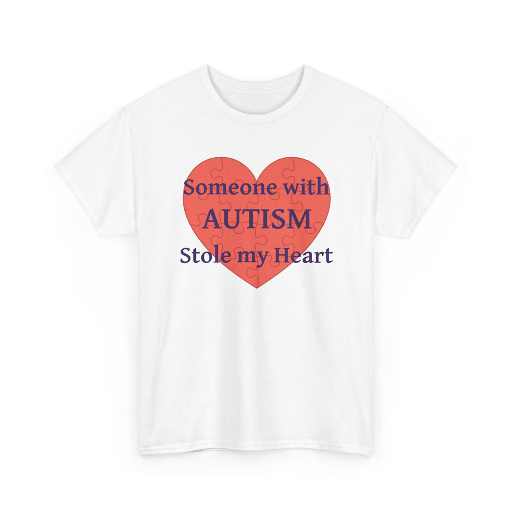 White t-shirt printed with a large salmon-red heart made of jigsaw puzzle pieces, lettered across it "Someone with AUTISM Stole my Heart", shown flat from another angle.