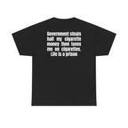 Black t-shirt, back printed with "Government steals half my cigarette money then taxes me on cigarettes. Life is a prison".