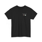 Black t-shirt printed with "My pronouns are all/in" in serif type above a roulette wheel and a fanned pile of banknotes, shown flat from another angle.