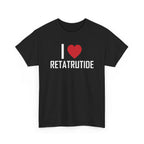 Black t-shirt printed with "I", a large red heart, then the word RETATRUTIDE, shown flat from another angle.