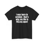 Black t-shirt printed with "I was born in october. that's why my life is FALLing apart", shown flat from another angle.