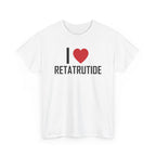 White t-shirt printed with "I", a large red heart, then the word RETATRUTIDE, shown flat from another angle.