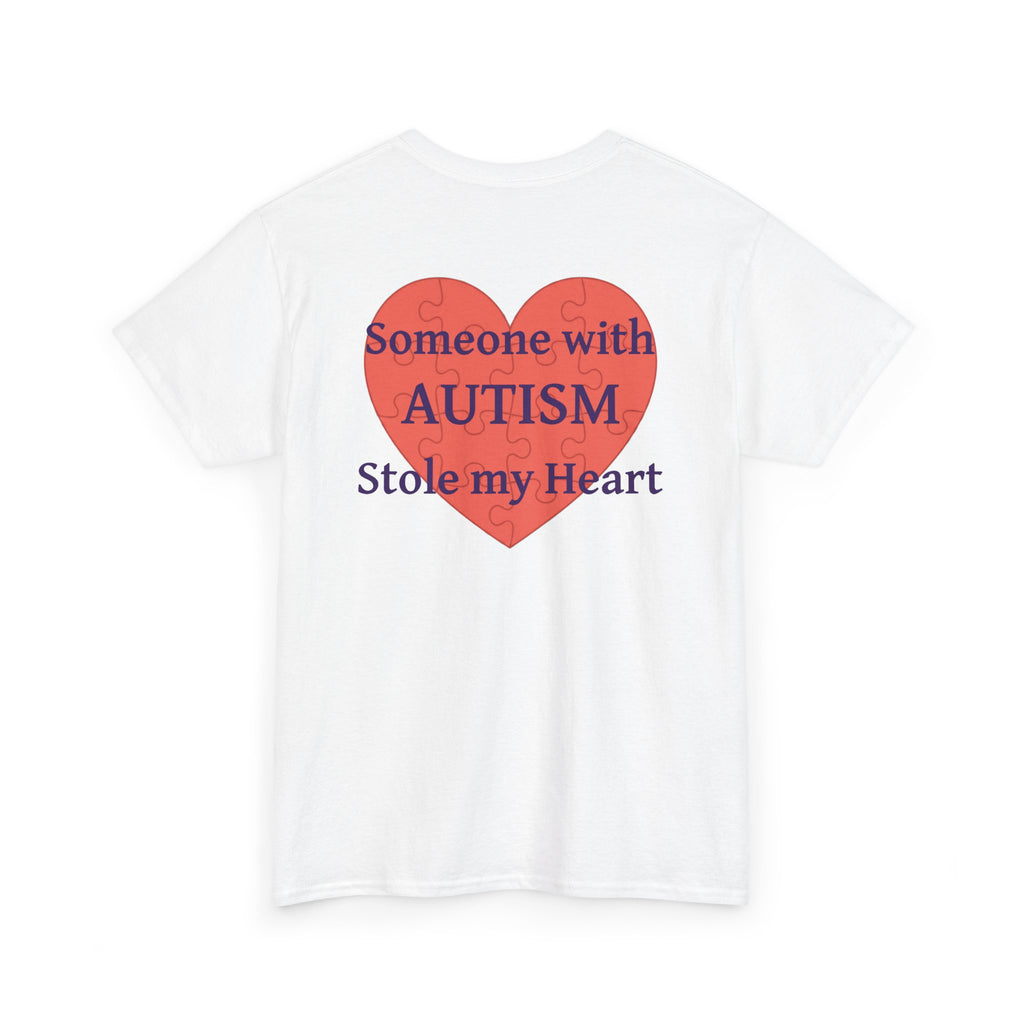 White t-shirt, back printed printed with a large salmon-red heart made of jigsaw puzzle pieces, lettered across it "Someone with AUTISM Stole my Heart", shown from another angle.