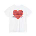 White t-shirt, back printed printed with a large salmon-red heart made of jigsaw puzzle pieces, lettered across it "Someone with AUTISM Stole my Heart", shown from another angle.