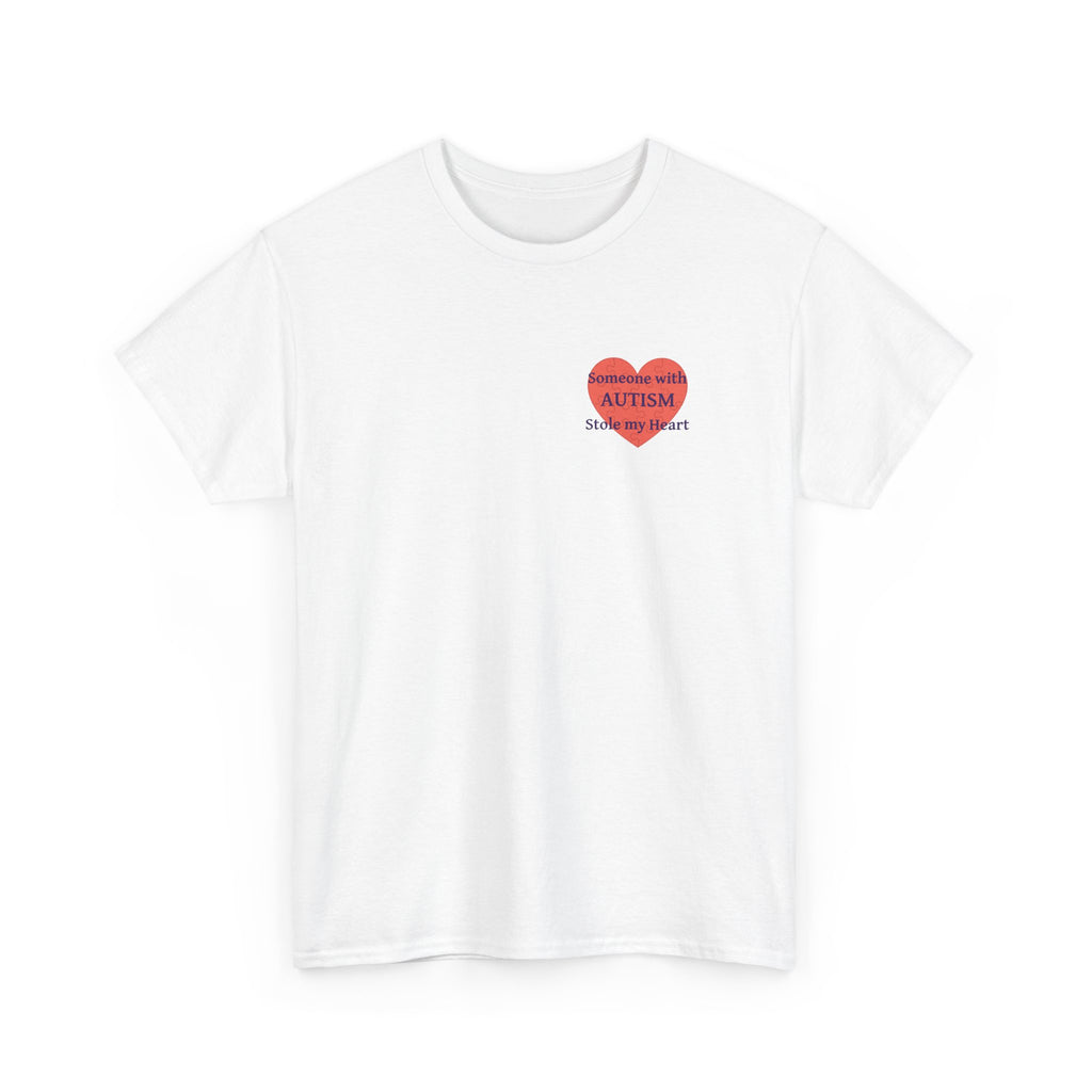 White t-shirt printed with a large salmon-red heart made of jigsaw puzzle pieces, lettered across it "Someone with AUTISM Stole my Heart", shown flat from another angle.
